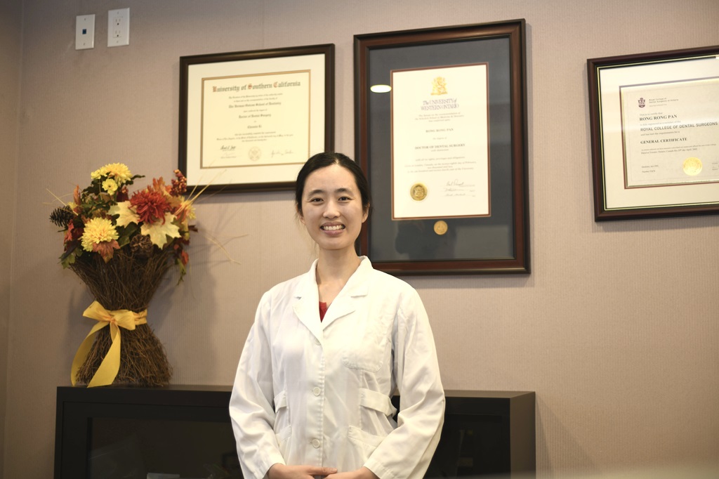 Dr. Cindy Li, DDS at Excel Dental in Hamilton, ON: Dr. Cindy Li smiling in her dental office at Excel Dental in Hamilton, Ontario.