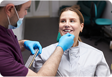 Dentist discussing family dental care with a patient